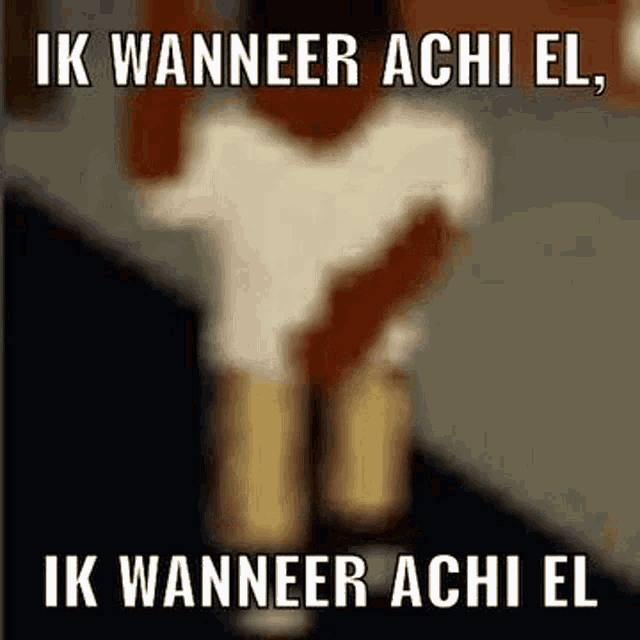 a blurry picture of a person standing on a sidewalk with the words `` ik wanneer achi el '' written on it .