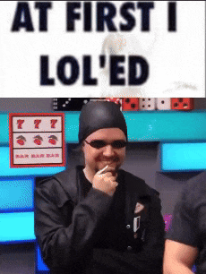 a man smoking a cigarette next to a sign that says " at first i lol 'ed "