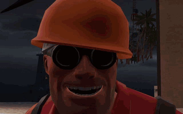 a man wearing a hard hat and goggles with a red emblem on it