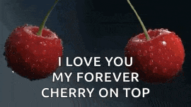 a couple of cherries with the words `` i love you my forever cherry on top '' written on them .