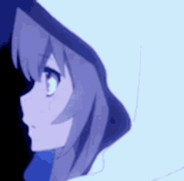 a close up of a girl wearing a hooded jacket and a blue scarf .