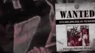 a wanted poster with a picture of a man standing next to it .