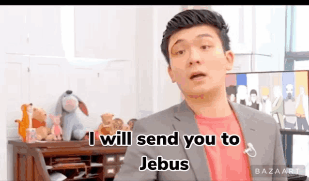 a man in a suit is standing in front of a desk with stuffed animals .