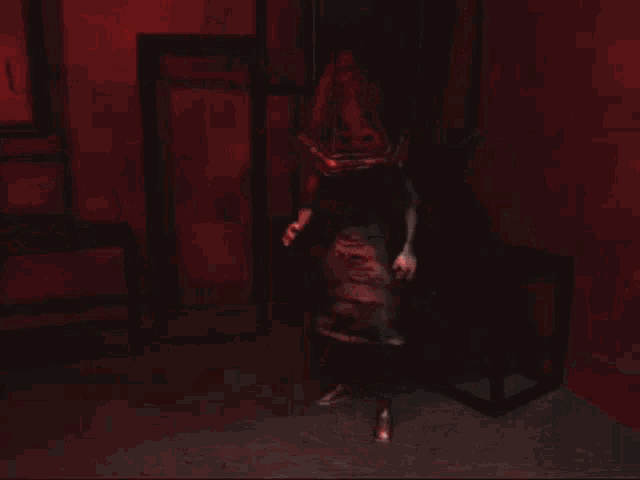 a pyramid head from silent hill 2 is standing in a dark room with a red background .