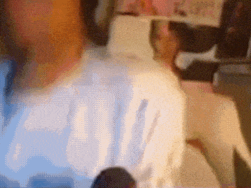 a blurry picture of a person 's face with the word ' a ' visible