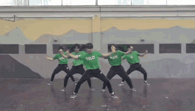 a group of people in green shirts that say oslo mate