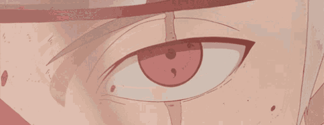 a close up of a person 's eye with a red spot on it