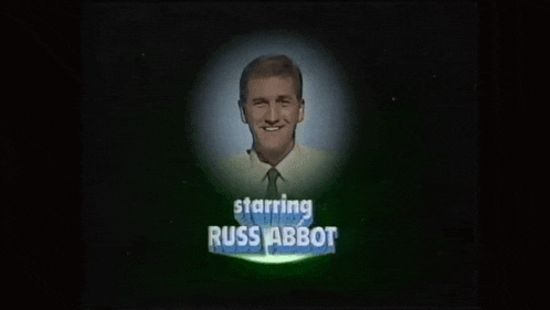 a picture of a man with the words starring russ abbot on it