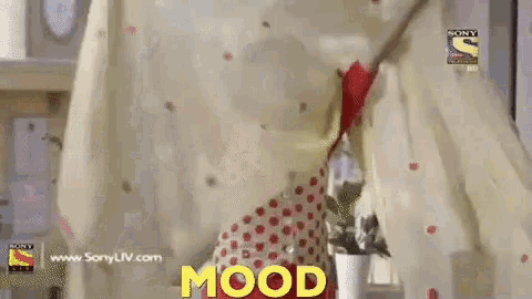 a woman in a red and white polka dot dress is holding a white cloth with the word mood written above her