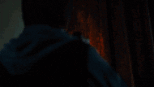 a close up of a person holding a guitar