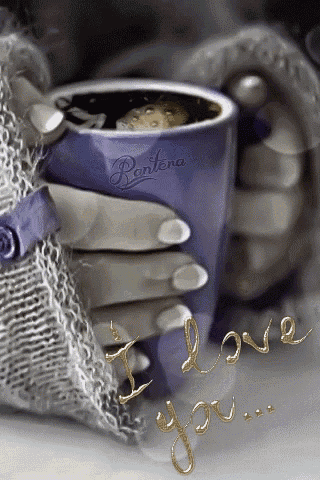 a person is holding a cup of coffee with the words i love you written on it