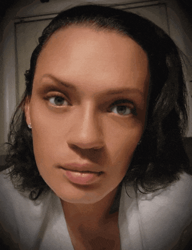a close up of a woman 's face with her eyes closed