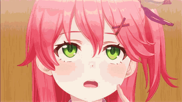 a girl with pink hair and green eyes has a cross on her head