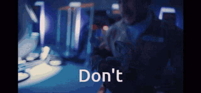 a blurry picture of a man with the words " do n't " written on the bottom