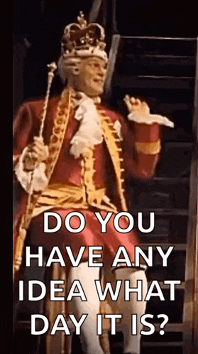 a man in a costume with a crown on his head is holding a cane and a sword .