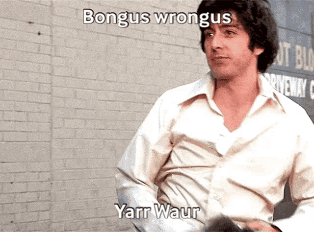 a man in a white shirt is standing in front of a brick wall with the words bongus wrongus yanr waur written above him
