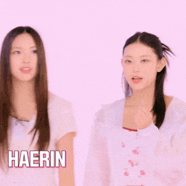two girls are standing next to each other and the name haerin is on the bottom