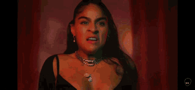 a woman is screaming with her mouth open in a video .