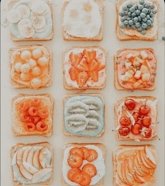 slices of toast with different toppings including fruit and berries