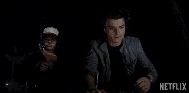 a netflix advertisement shows a ghostly figure in a dark room