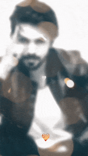 a blurry picture of a man with a heart in the middle