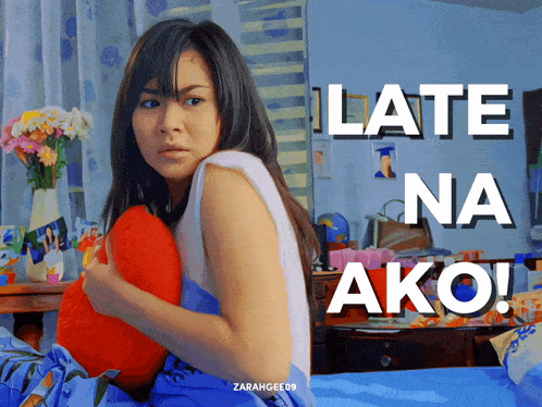 a poster of a woman holding a pillow with the words late na ako below her