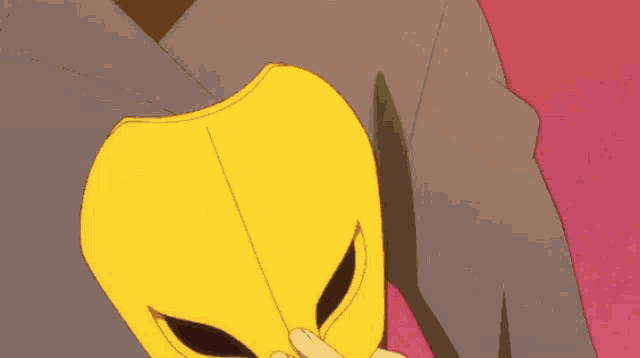 a cartoon character with a yellow mask on covering his face