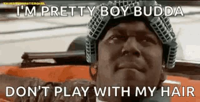a man wearing a helmet says `` i 'm pretty boy budda do n't play with my hair ''