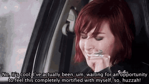 a woman with red hair is sitting in a car and says " no it 's cool i 've actually been
