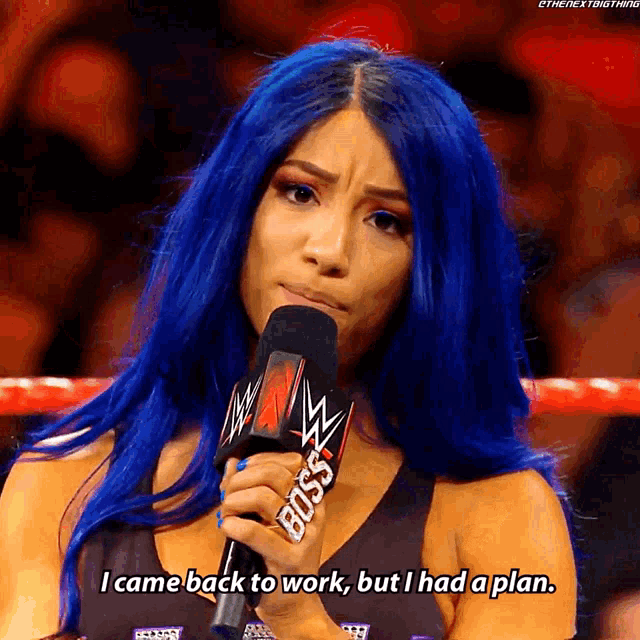 a woman with blue hair is holding a microphone that says boss on it