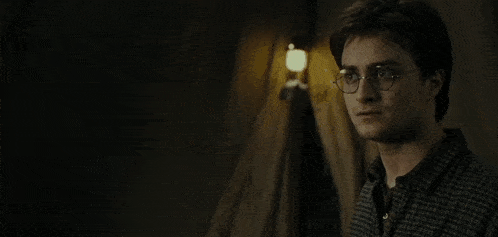 harry potter and ron weasley are standing next to each other