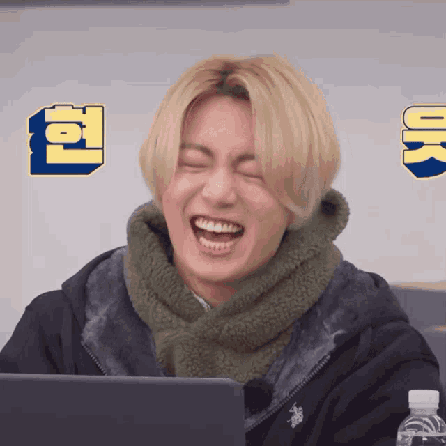 a young man wearing a us polo assn jacket laughs with his eyes closed