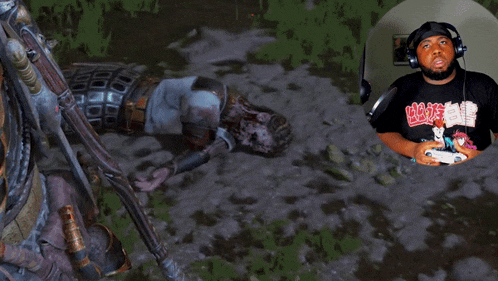 a man wearing headphones is playing a video game and has a t-shirt that says ' ghost ' on it