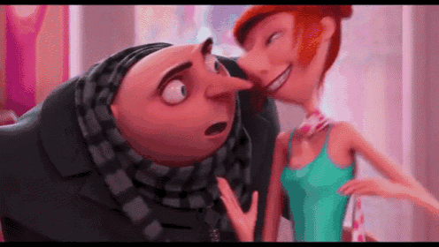 a cartoon character is kissing a woman on the cheek in a pink room .