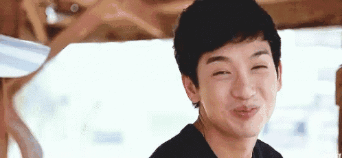a young man is making a funny face and making a funny face with his eyes closed .
