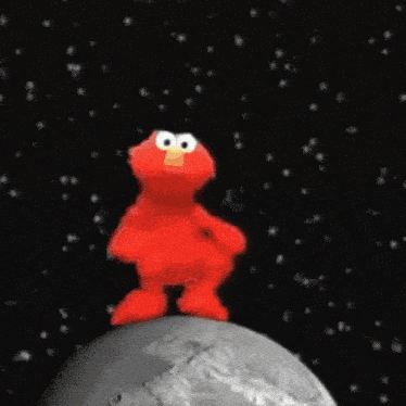 elmo is standing on a planet in space