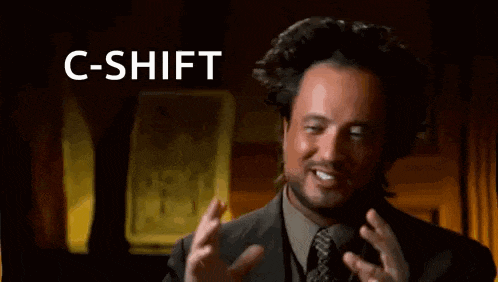 a man in a suit and tie is making a funny face and says c-shift