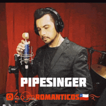 a man wearing headphones singing into a microphone with the name pipesinger on the bottom right