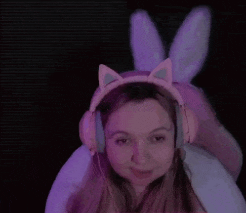 a woman wearing headphones and bunny ears says " thank you murder "