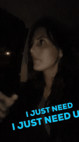 a woman says " i just need u " in blue letters