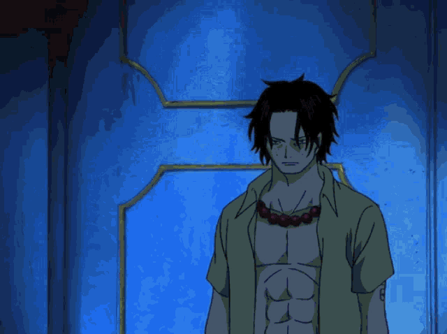 a man in a green shirt with a red necklace is standing in front of a blue wall