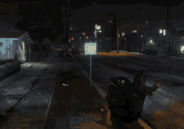 a person is riding a motorcycle down a city street at night