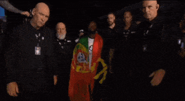 a man wearing a badge that says ufc walks through a crowd