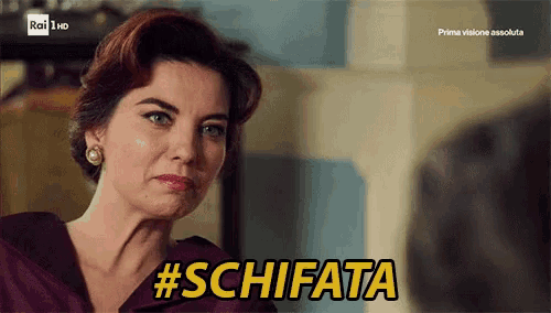 a woman in a purple dress says schifata