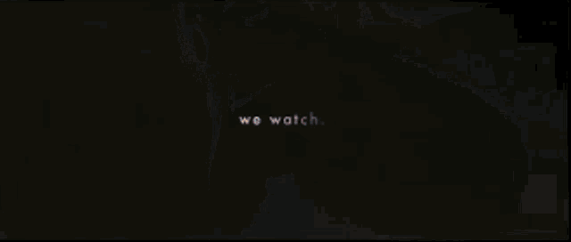 a close up of a woman 's face with the words we watch behind her