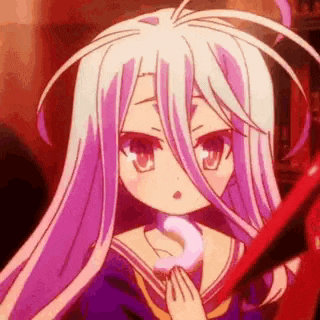 a girl with white hair and purple eyes is holding a red object .
