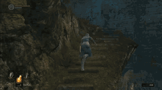a screenshot of a video game shows a knight in a dark tunnel