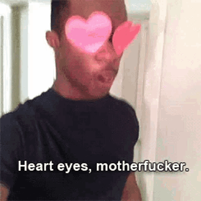 a man with heart shaped eyes and the words `` heart eyes , motherfucker '' behind him .