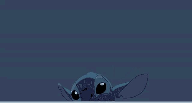 a stitch cartoon character is peeking out from behind a dark blue background