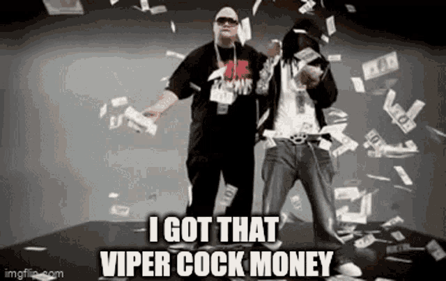 two men are standing in front of a pile of money and holding money .